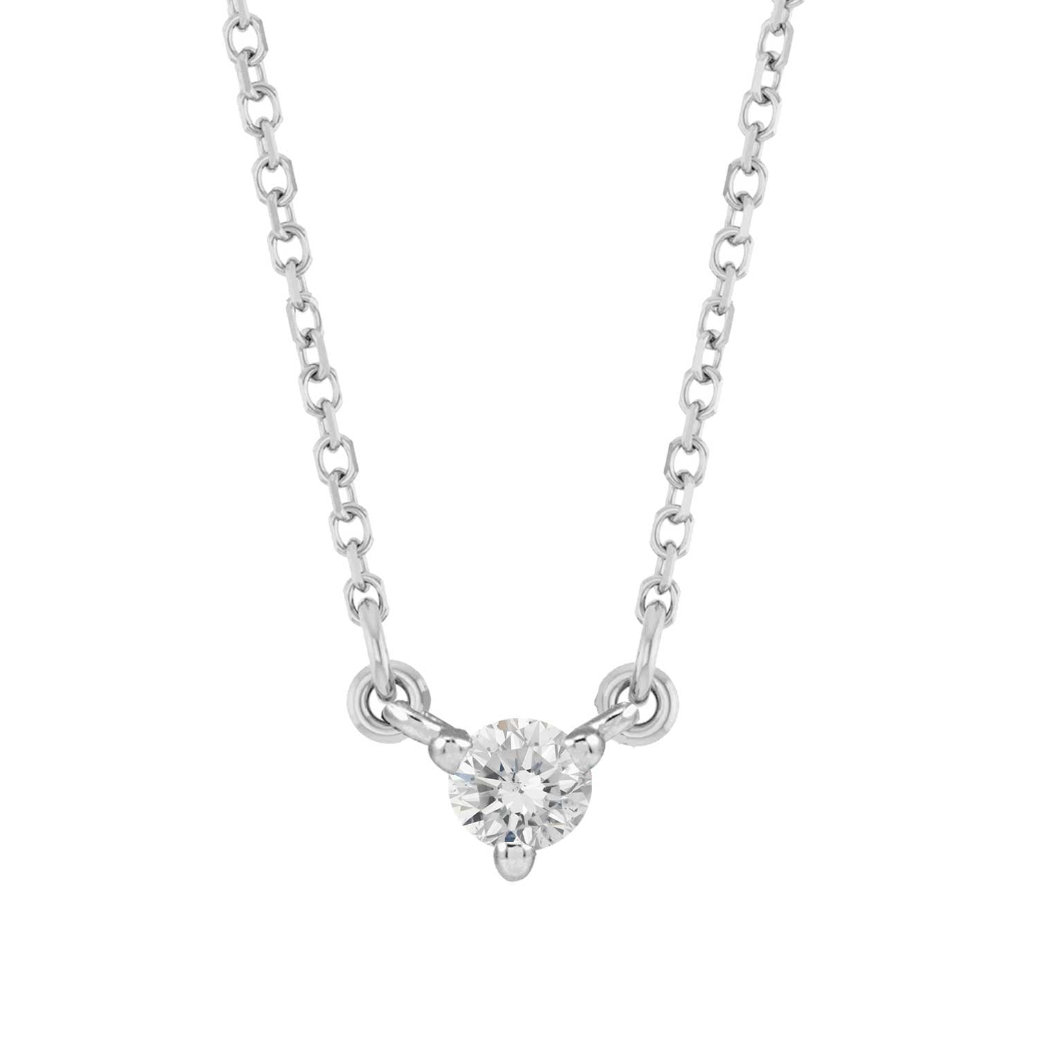 Minimalist 14K gold necklace with a small round diamond gemstone pendant.