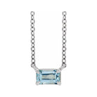Emerald-cut aquamarine birthstone necklace set in 14K yellow gold with vertical minimalist pendant design