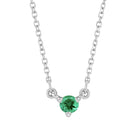 Minimalist 14K gold necklace with a small round emerald gemstone pendant.