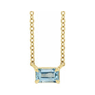 Modern 14K white gold necklace featuring vertical emerald-cut aquamarine gemstone for birth month elegance