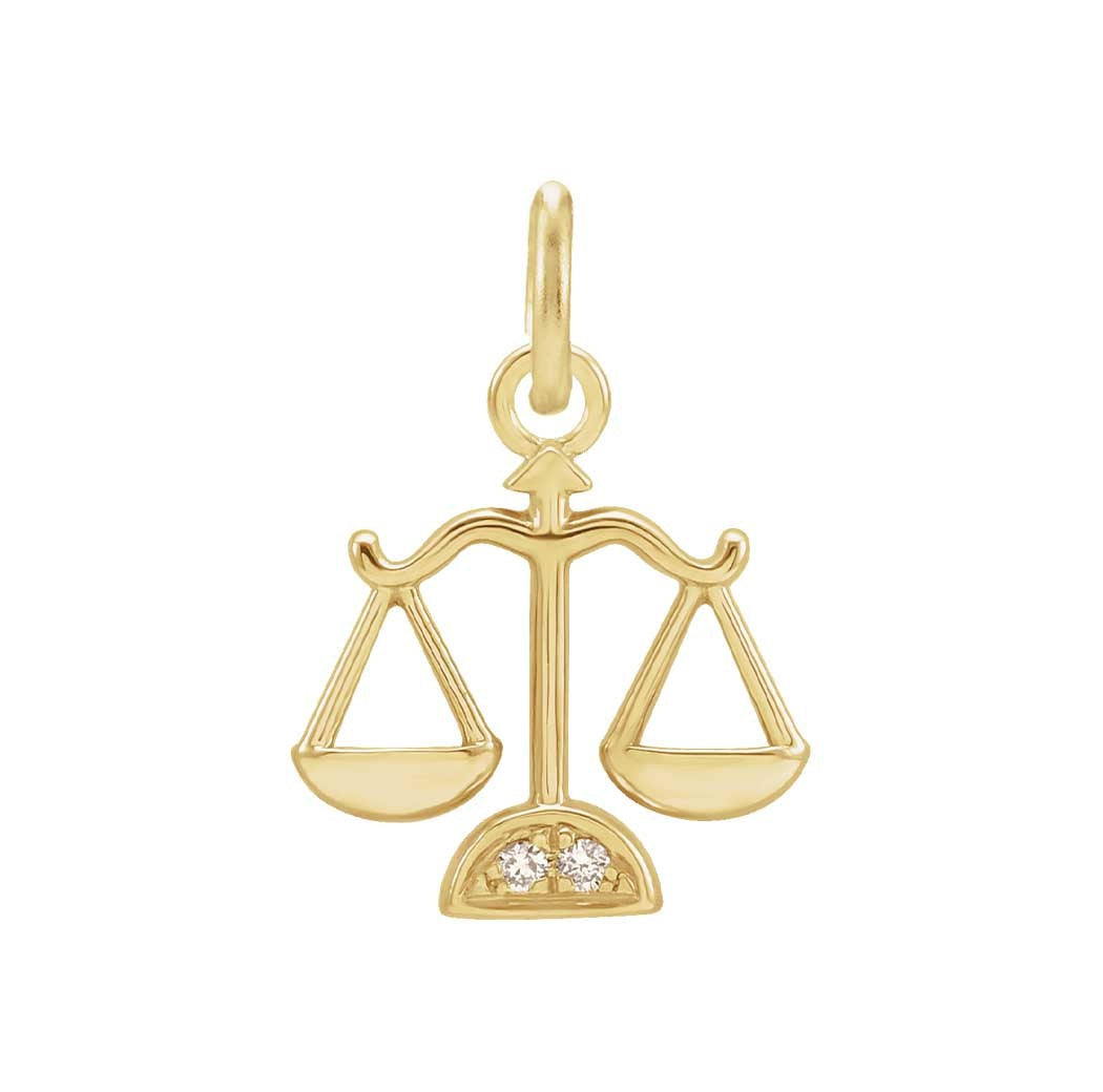 Delicate Libra astrology charm featuring tiny diamonds and gold