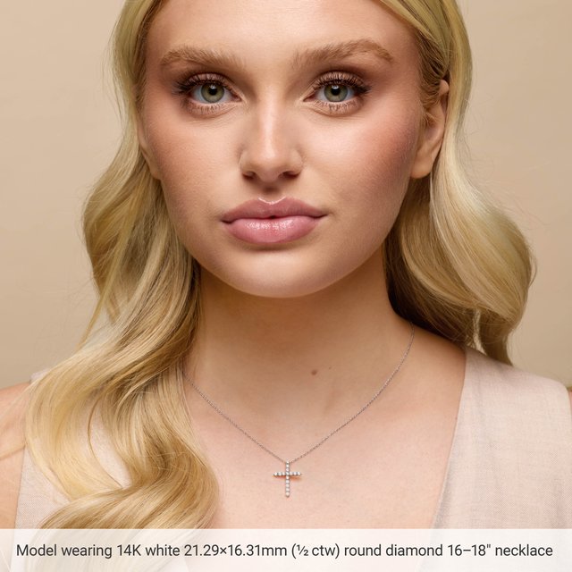 classic diamond cross necklace for everyday wear shown on model