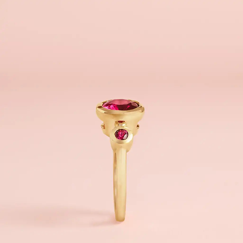 Modern three-stone ruby ring in yellow gold