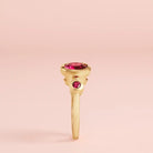 Modern three-stone ruby ring in yellow gold