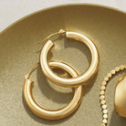 4mm wide tube hoop earrings in polished 14K gold