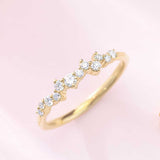 Scattered diamond band in 14K gold, front view