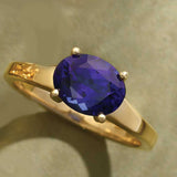 Oval sapphire cocktail ring in 14K gold, front view of 2.5 carat blue gemstone