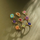 Gemmy cocktail ring with turquoise cabochons styled in editorial setting
