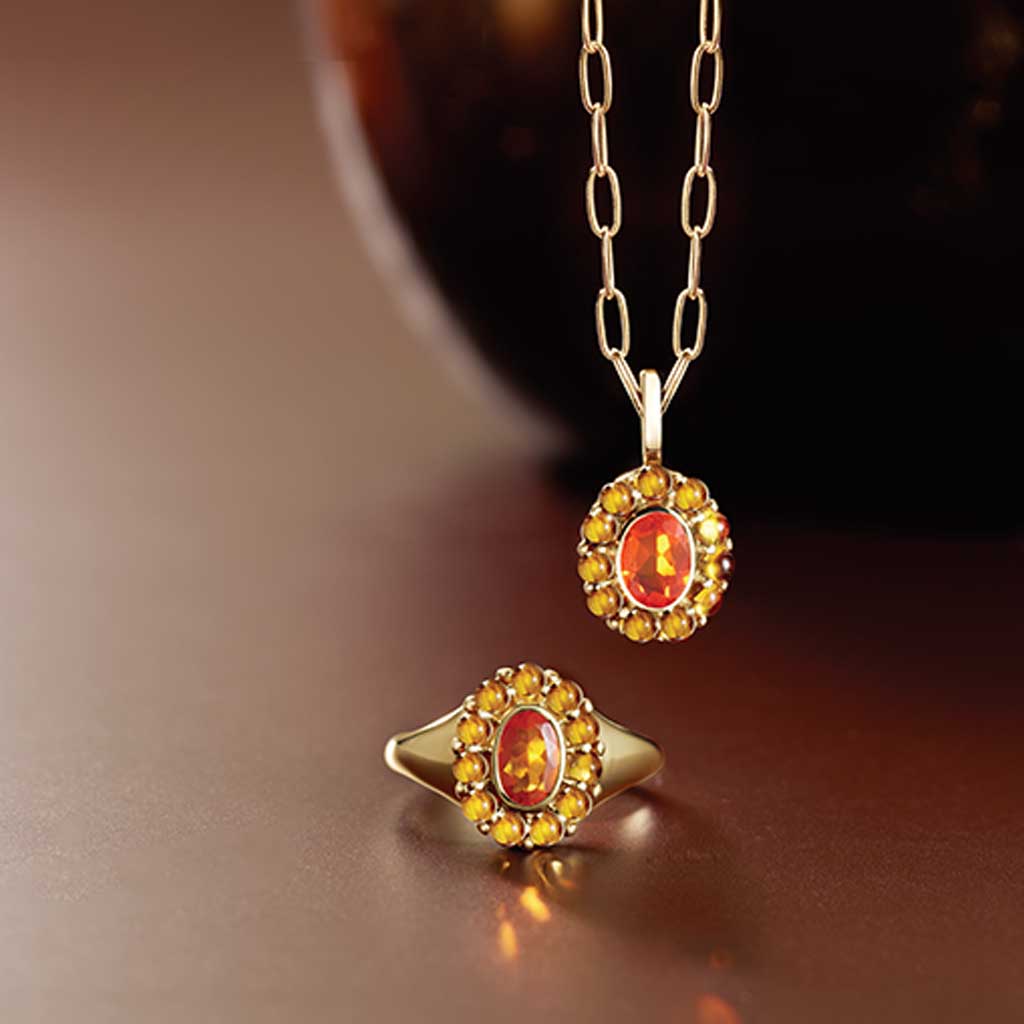 Gemmy halo cocktail ring with amethyst cabochons, editorial detail view