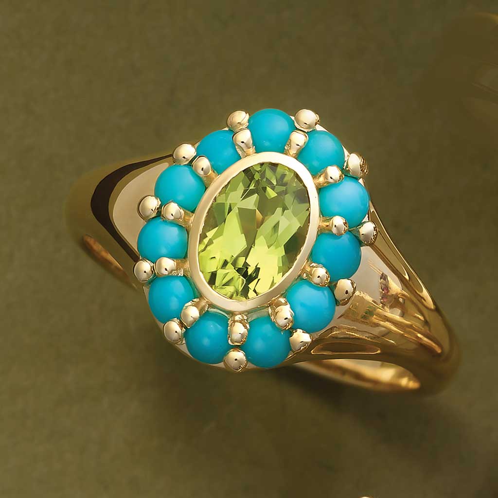 Gemmy halo cocktail ring with turquoise cabochons in 14K yellow gold