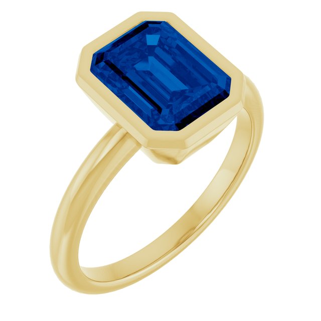 Modern gemstone cocktail ring on hand variant--14K-yellow-gold variant--Sapphire variant--Emerald