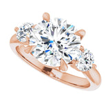 Three-stone engagement ring with round side stones in 14K gold, diamond center, showing setting detail variant--Round variant--3CT variant--14K-rose-gold