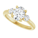 Three-stone engagement ring with round side stones in 14K gold, diamond center, on hand variant--Oval variant--1CT variant--14K-yellow-gold