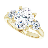 Three-stone engagement ring with round side stones in 14K gold, diamond center, three-quarter angle variant--Oval variant--2CT variant--14K-yellow-gold