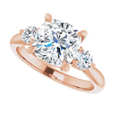 Three-stone engagement ring with round side stones in 14K gold, diamond center, close-up of round side stones variant--Cushion variant--3CT variant--14K-rose-gold