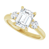 Three-stone engagement ring with round side stones in 14K gold, diamond center, on hand variant--Emerald variant--2CT variant--14K-yellow-gold