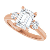 Three-stone engagement ring with round side stones in 14K gold, diamond center, showing setting detail variant--Emerald variant--2CT variant--14K-rose-gold