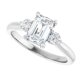 Three-stone engagement ring with round side stones in 14K gold, diamond center, showing setting detail variant--Emerald variant--1CT variant--14K-white-gold