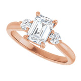 Three-stone engagement ring with round side stones in 14K gold, diamond center, three-quarter angle variant--Emerald variant--1CT variant--14K-rose-gold
