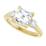 Three-stone engagement ring with round side stones in 14K gold, diamond center, three-quarter angle variant--Asscher variant--2CT variant--14K-yellow-gold