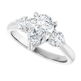 Three-stone engagement ring with round side stones in 14K gold, diamond center, showing setting detail variant--Pear variant--2CT variant--14K-white-gold