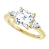 Three-stone engagement ring with pear side stones in 14K gold, diamond center, three-quarter angle variant--Asscher variant--2CT variant--14K-yellow-gold