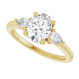 Three-stone engagement ring with pear side stones in 14K gold, diamond center, on hand variant--Oval variant--1CT variant--14K-yellow-gold