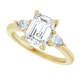 Three-stone engagement ring with pear side stones in 14K gold, diamond center, three-quarter angle variant--Emerald variant--2CT variant--14K-yellow-gold