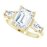 Three-stone baguette side stone ring in 14K gold, diamond center, on hand variant--Emerald variant--2CT variant--14K-yellow-gold
