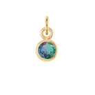 Delicate bezel-set alexandrite charm symbolizing June's birthstone in fine gold
