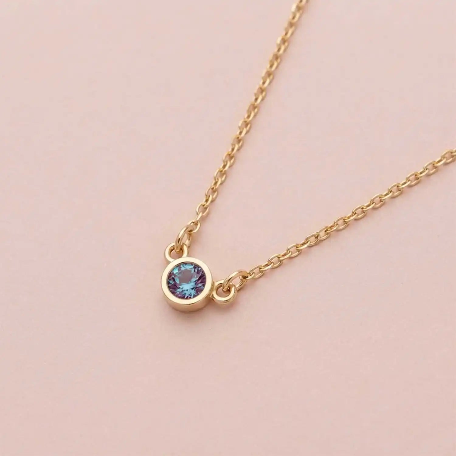 Bezel-set alexandrite birthstone necklace in 14K yellow gold on cable chain variant--14K yellow gold