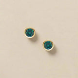 Alexandrite stud earrings in 14K gold, 4mm color-shifting stone, product shot