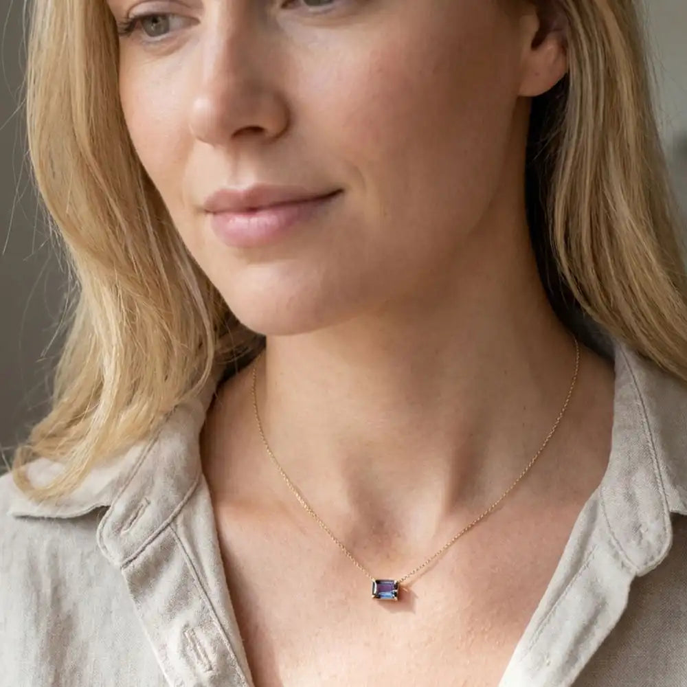 Gold Alexandrite necklace with emerald-cut gem shown on model variant--14K-yellow-gold variant--14K-white-gold variant--14K-rose-gold variant--Sterling-silver
