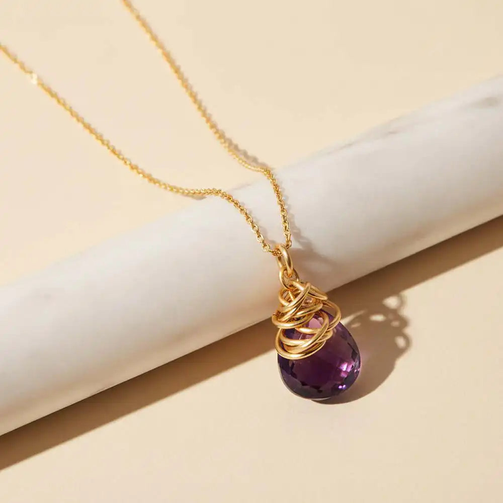Natural amethyst pendant necklace in sterling silver, styled on chain necklace