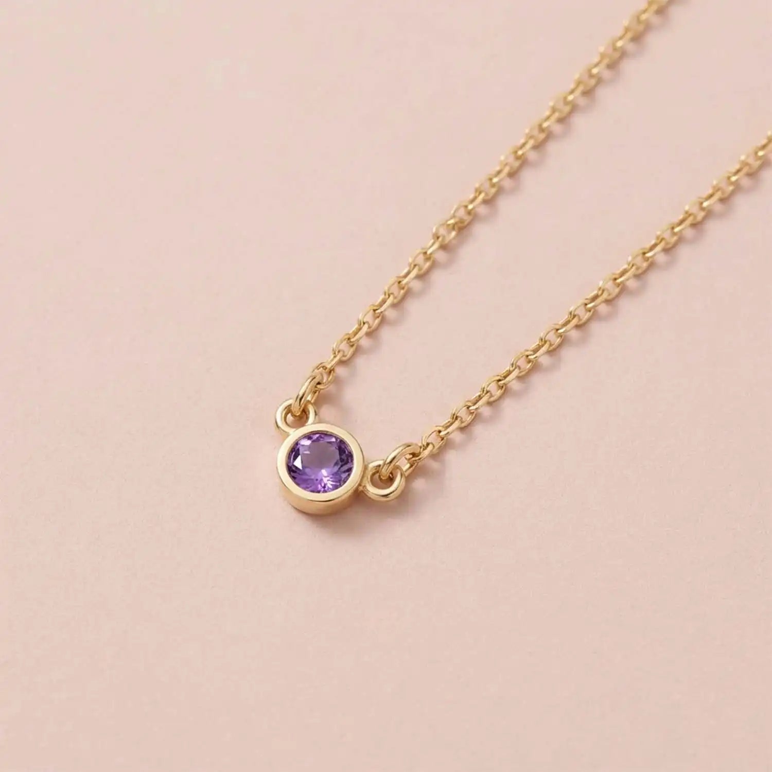 Bezel-set amethyst birthstone necklace in 14K yellow gold on cable chain variant--Sterling silver