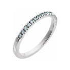 Handcrafted stackable ring in 14K white gold, adorned with a subtle aquamarine gem.