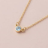 Bezel-set aquamarine birthstone necklace in 14K white gold on cable chain