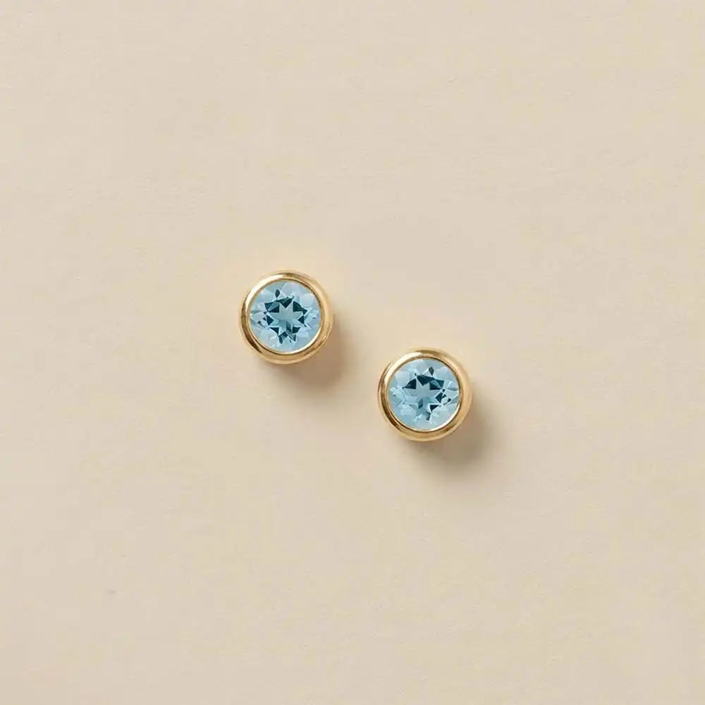 Aquamarine stud earrings in 14K gold, 5mm natural stone, product shot on white
