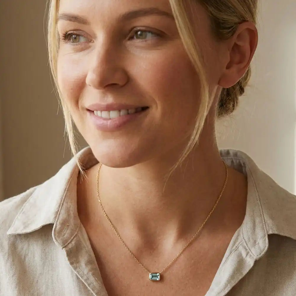 March birthstone necklace featuring pale blue aquamarine shown on model variant--14K-yellow-gold variant--14K-white-gold variant--14K-rose-gold variant--Sterling-silver variant--Aquamarine