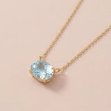 14K gold east-west necklace with oval aquamarine birthstone variant--14K-rose-gold variant--14K-white-gold variant--14K-yellow-gold variant--Sterling-silver variant--Aquamarine
