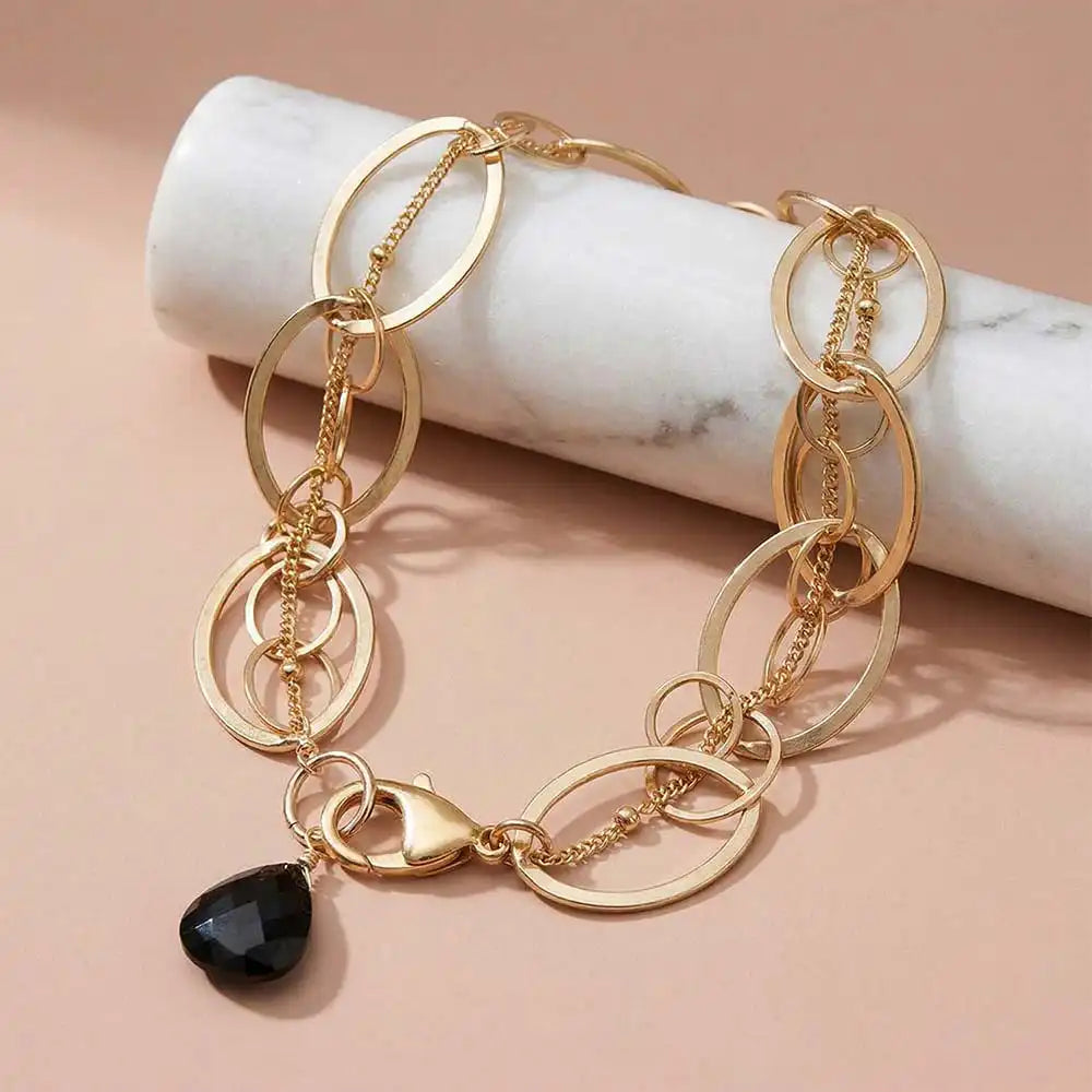 Natural black sapphire woven chain bracelet in sterling silver, styled on chain necklace