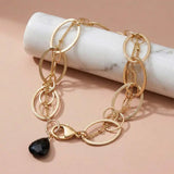 Natural black sapphire woven chain bracelet in sterling silver, styled on chain necklace