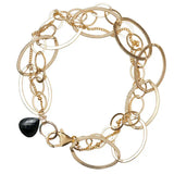 Natural black sapphire woven chain bracelet in 14K gold-fill, close-up of setting in sterling silver variant--Gold-fill