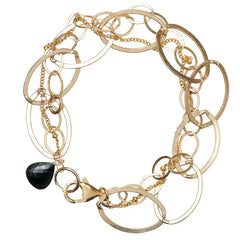 Natural black sapphire woven chain bracelet in 14K gold-fill, close-up of setting in