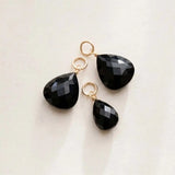 Natural black sapphire briolette charm in sterling silver, styled on chain necklace