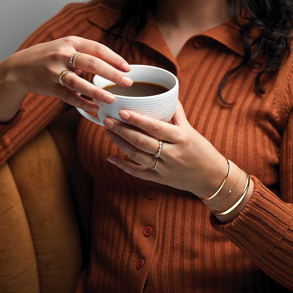 Round hinged cuff in 14K gold, side profile showing round form
