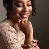 Square tube hinged bangle in 14K gold, on wrist showing square profile