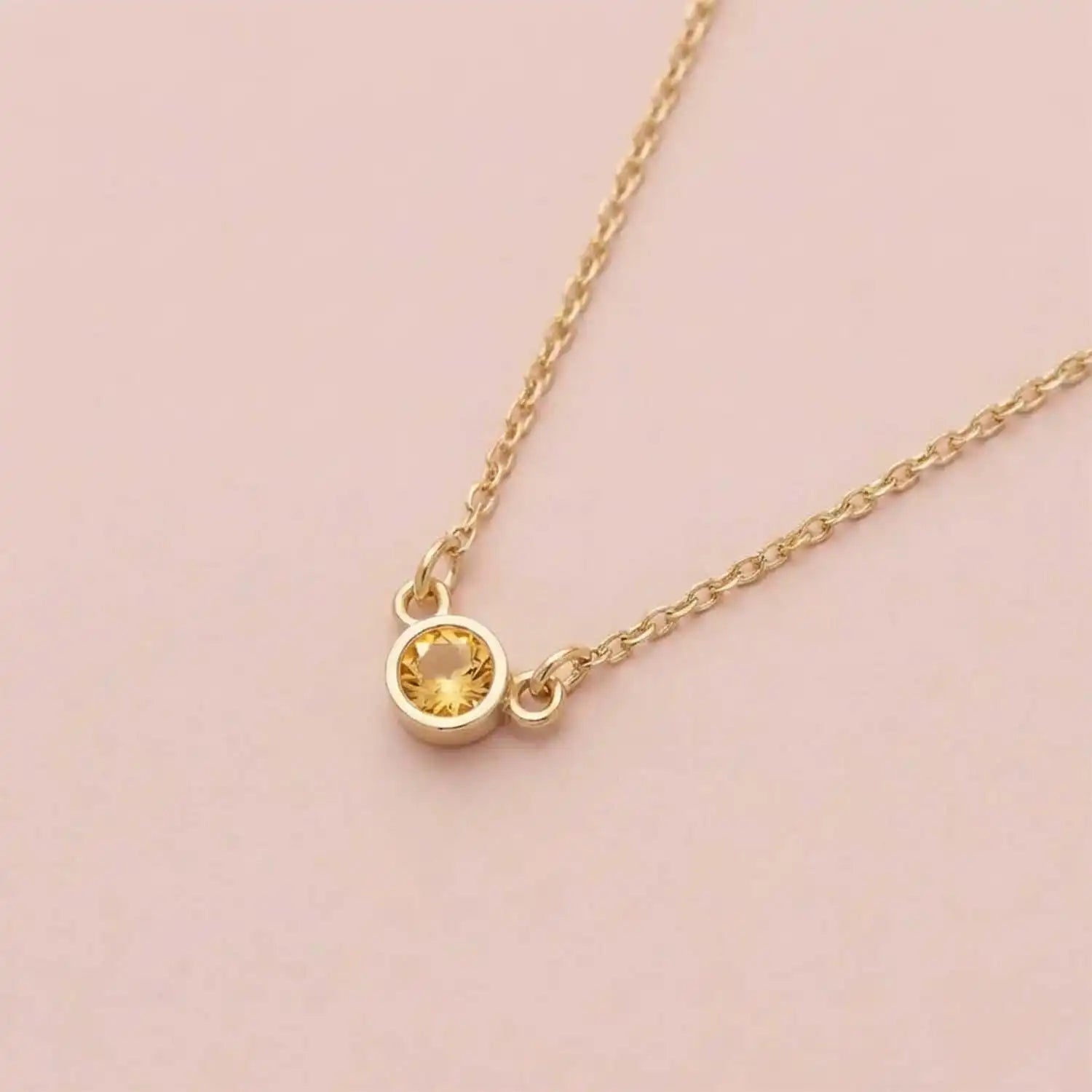 Bezel-set citrine birthstone necklace in 14K yellow gold on cable chain