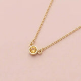 Bezel-set citrine birthstone necklace in 14K yellow gold on cable chain