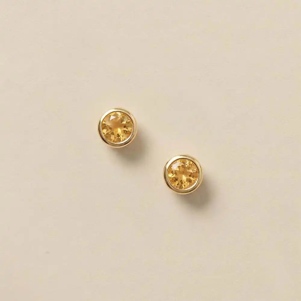 Citrine stud earrings in 14K gold, 4mm warm golden stone, product shot